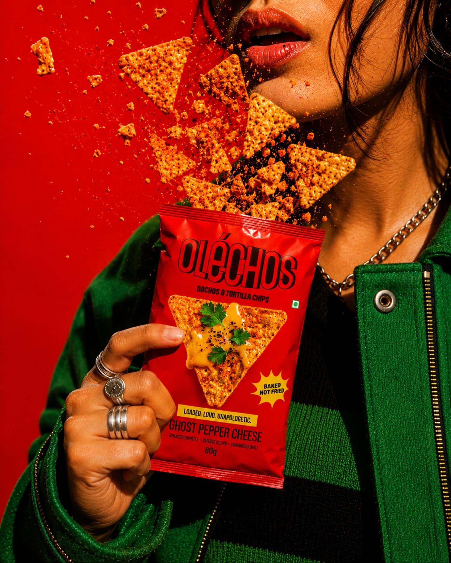 Olechos chips campaign: model holding a bag of Ghost Pepper Cheese tortilla chips